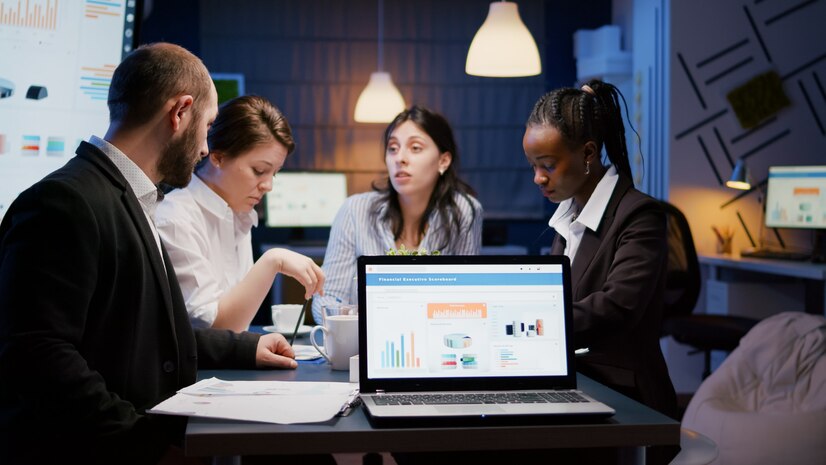 laptop-computer-with-financial-graphs-presentation-monitor-standing-conference-table-meeting-room-late-night_482257-2394.jpg